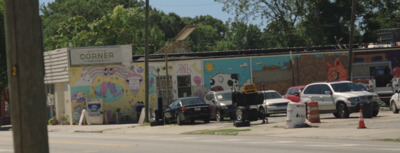 a group of cars parked in front of a building