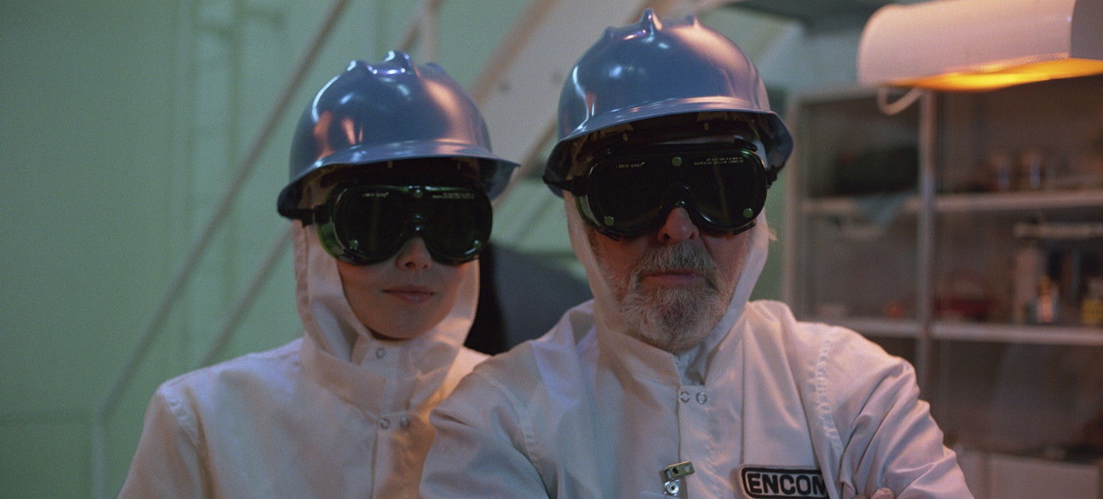 a man and a woman wearing hard hats and sunglasses