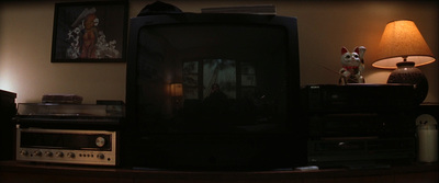 a television sitting on top of a wooden table