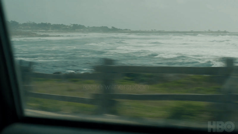 a view of a body of water from a train window