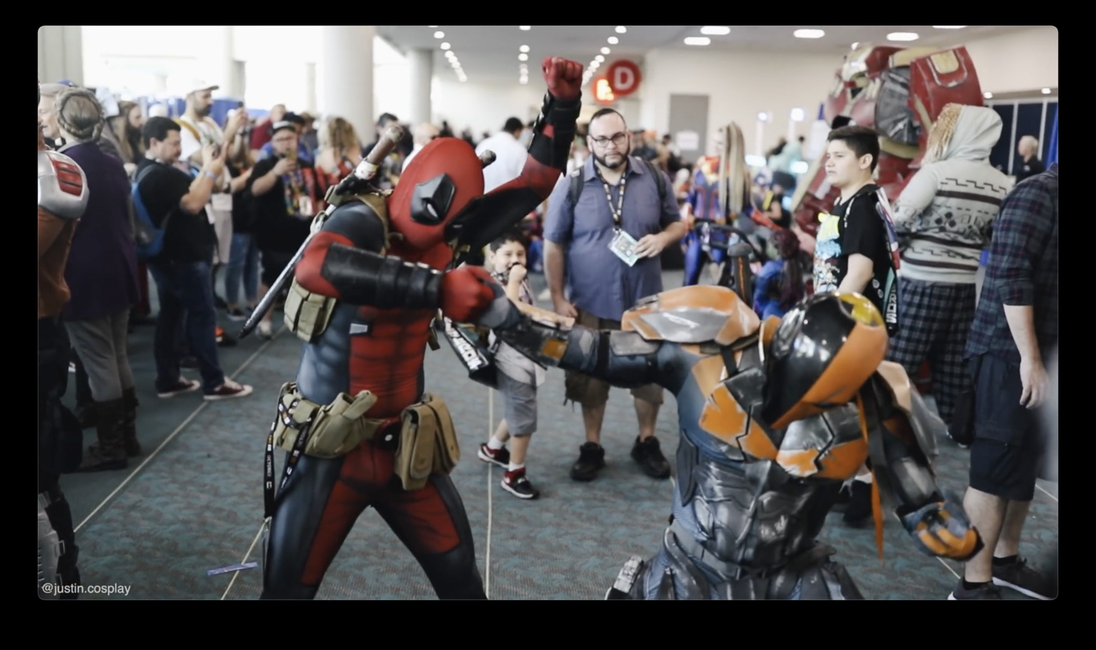 a group of people in costumes at a convention