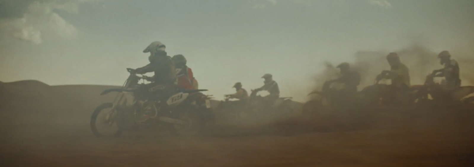 a group of people riding on the back of motorcycles