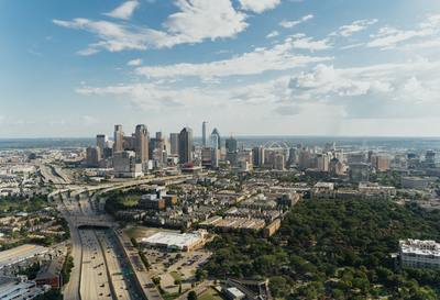 an aerial view of a city with tall buildings