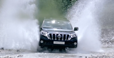 a car driving through a puddle of water