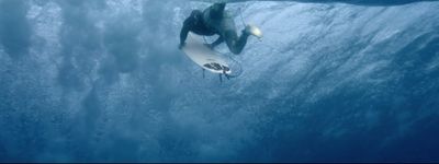 a man riding a surfboard under water