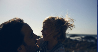 a man and a woman are looking at each other