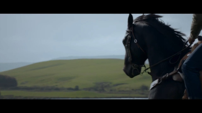 a man riding on the back of a black horse