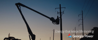 an electrician is working on a power pole