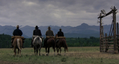 a group of men riding on the backs of horses