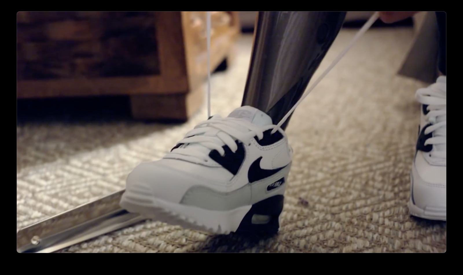 a pair of white and black sneakers on the ground