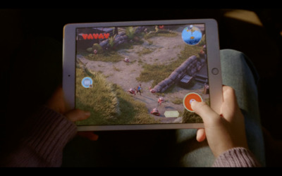 a person playing a game on a tablet