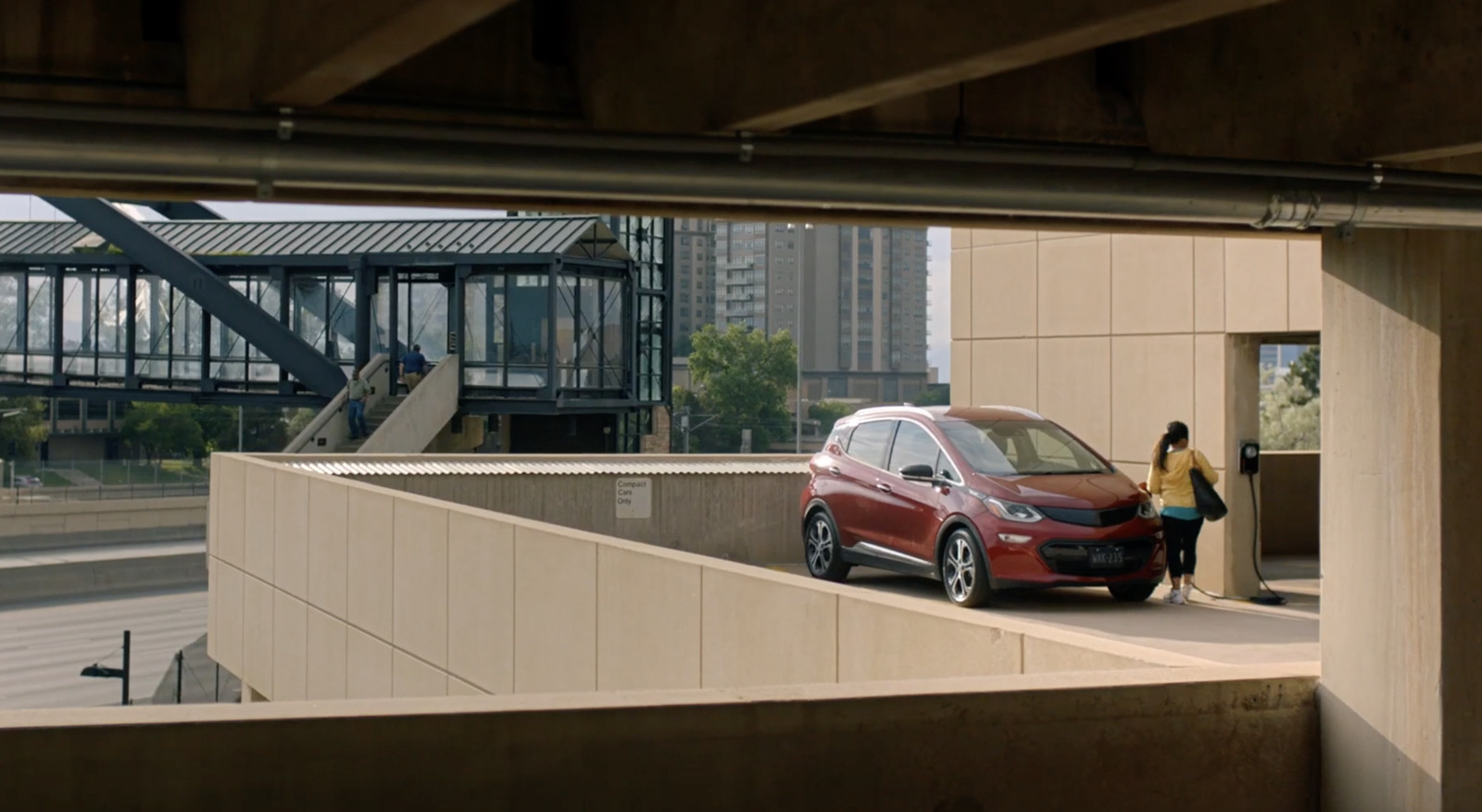 a red car parked in front of a building