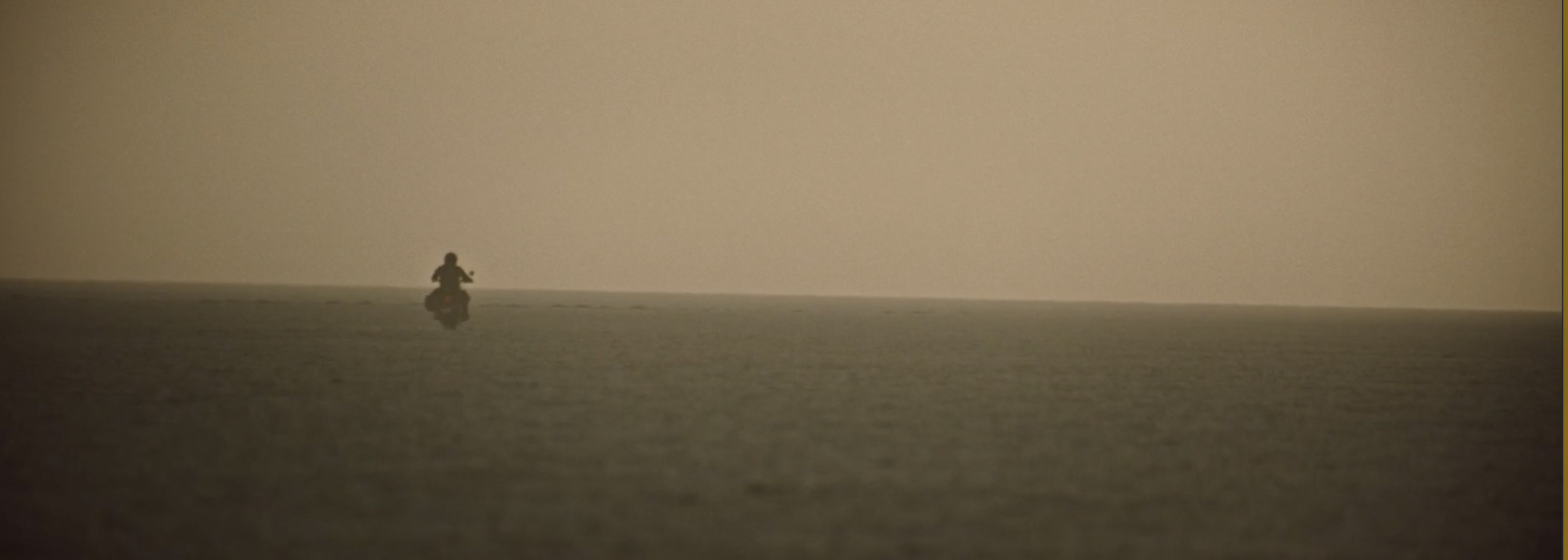 a person standing in the middle of a large body of water