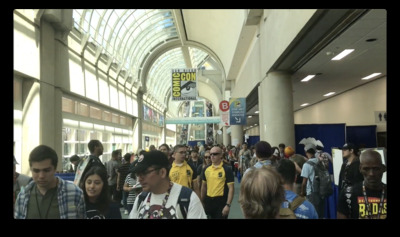 a large group of people walking through a building