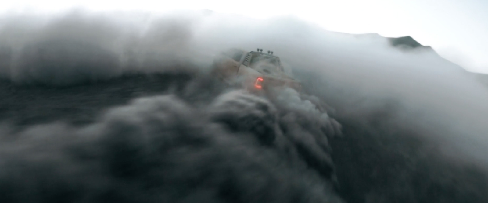 a train on a train track surrounded by smoke