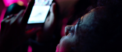 a close up of a person holding a cell phone