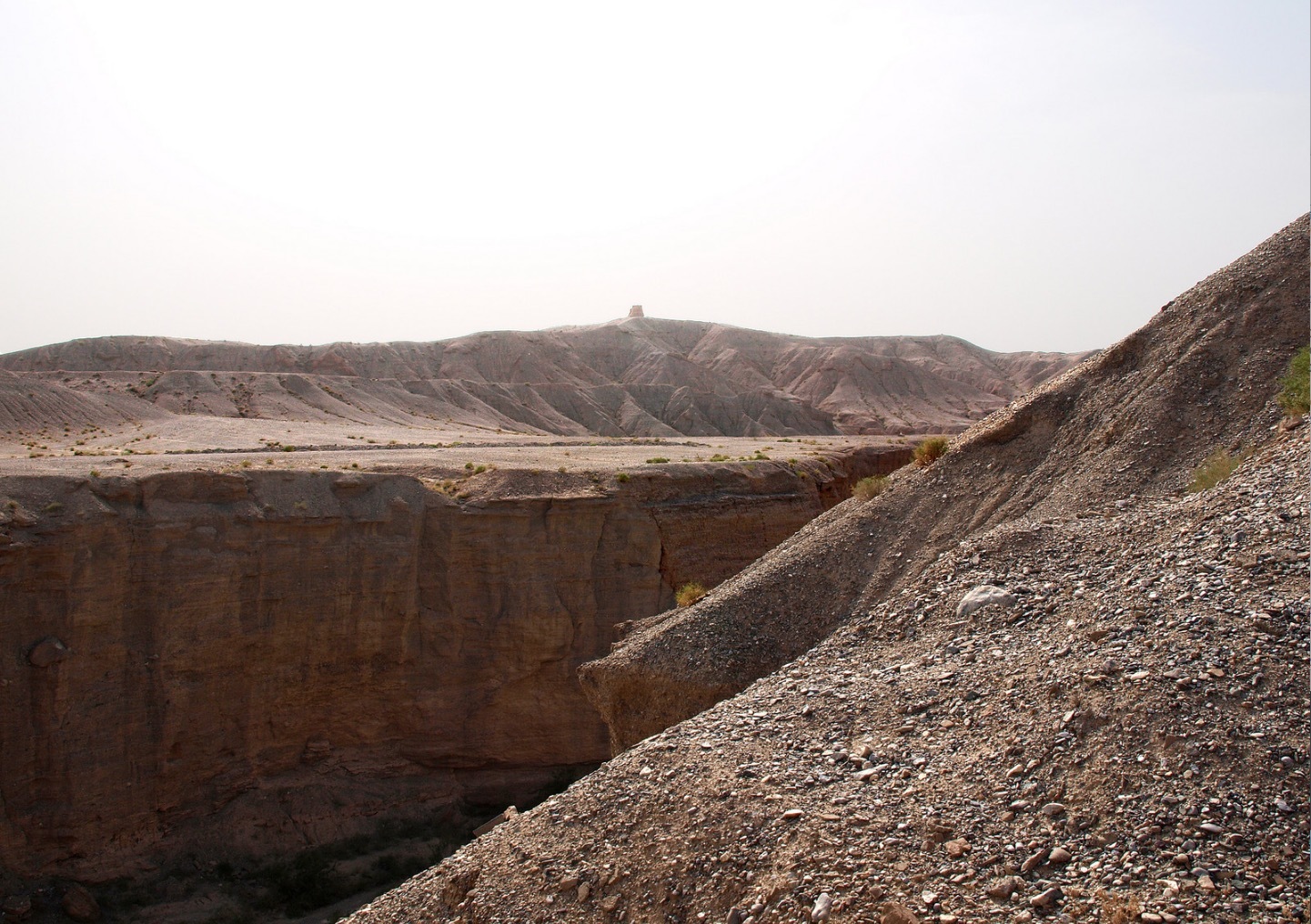 a man standing on top of a large cliff