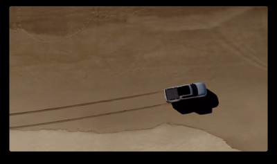 an aerial view of a car on a wire