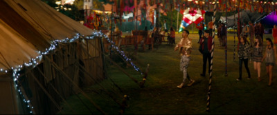 a group of people standing around a tent