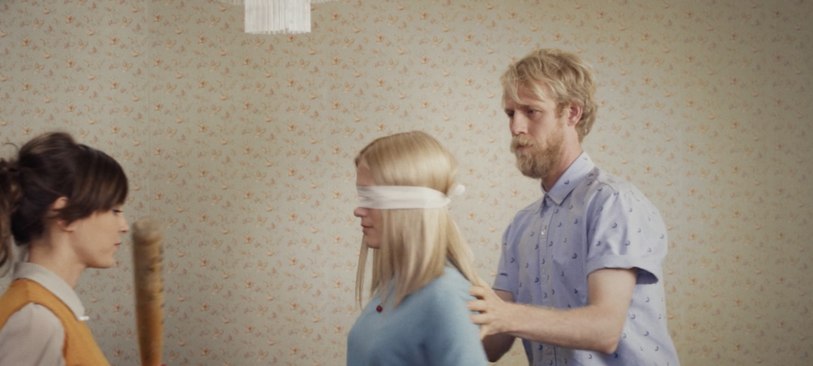 a man standing next to a woman in a room