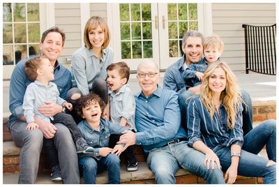 a group of people that are sitting on a step