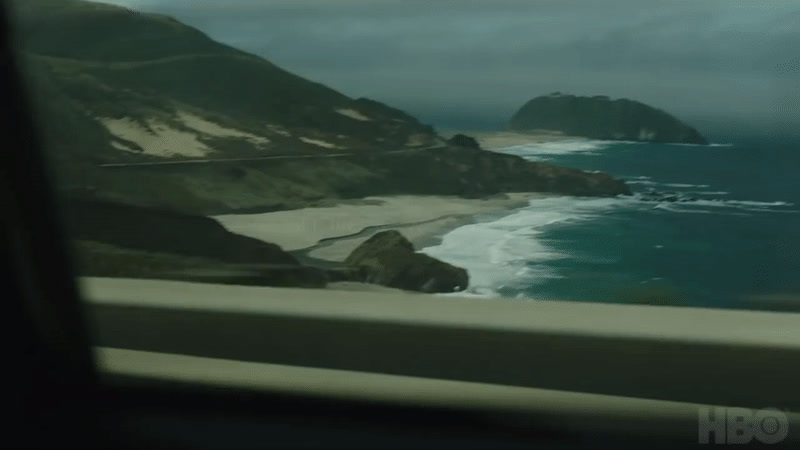 a view of the ocean from inside a vehicle