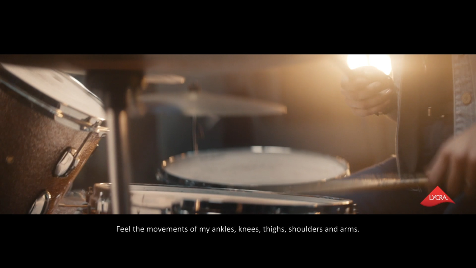 a person playing drums in a dark room