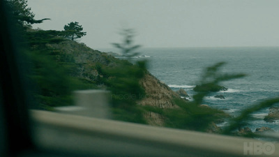 a view of the ocean from a vehicle window