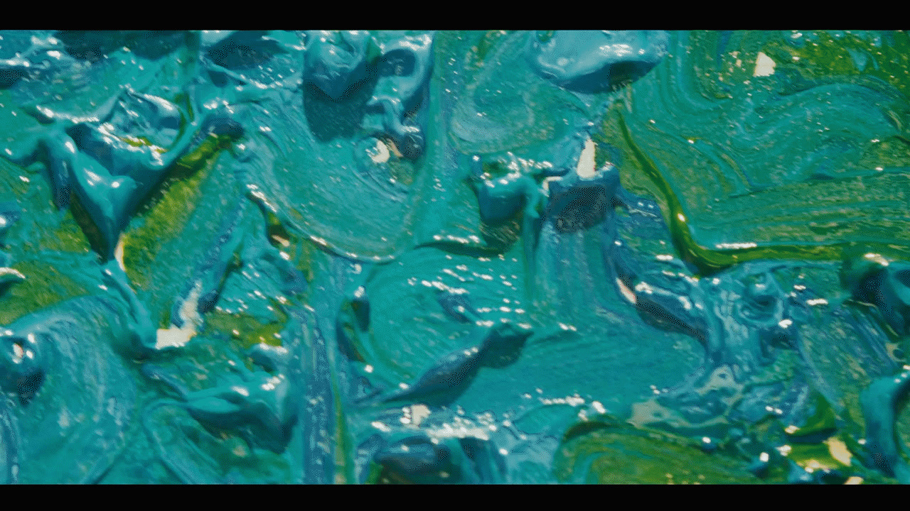 a close up of a blue and green paint