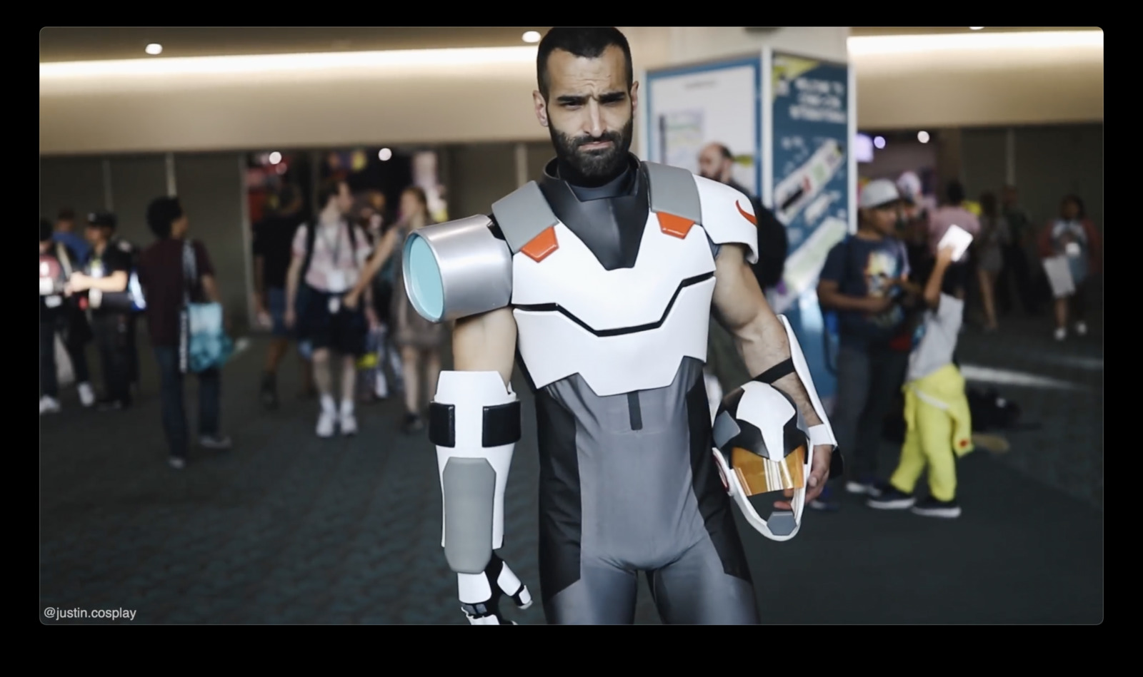 a man dressed as a robot in a crowd of people