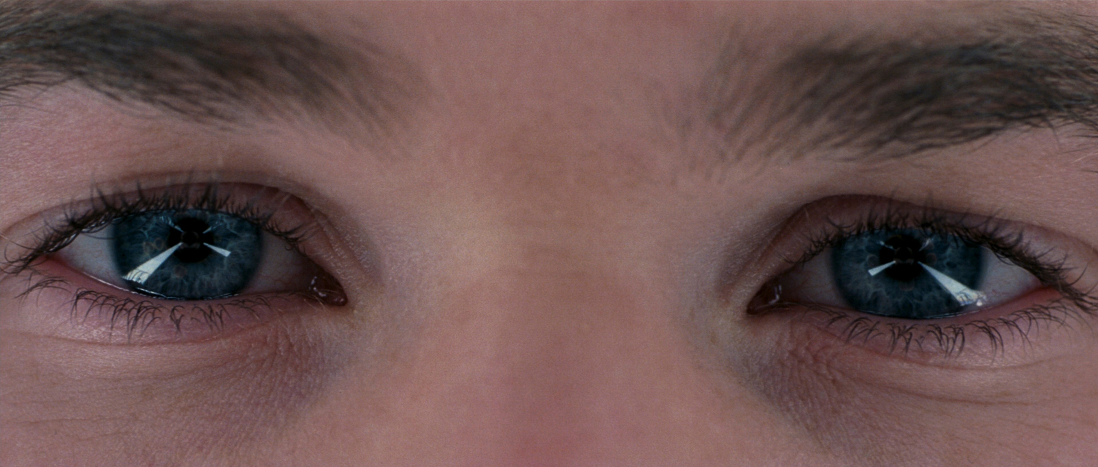 a close up of a person's blue eyes