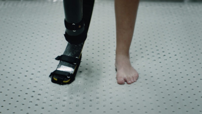 a close up of a person's foot with a device attached to it