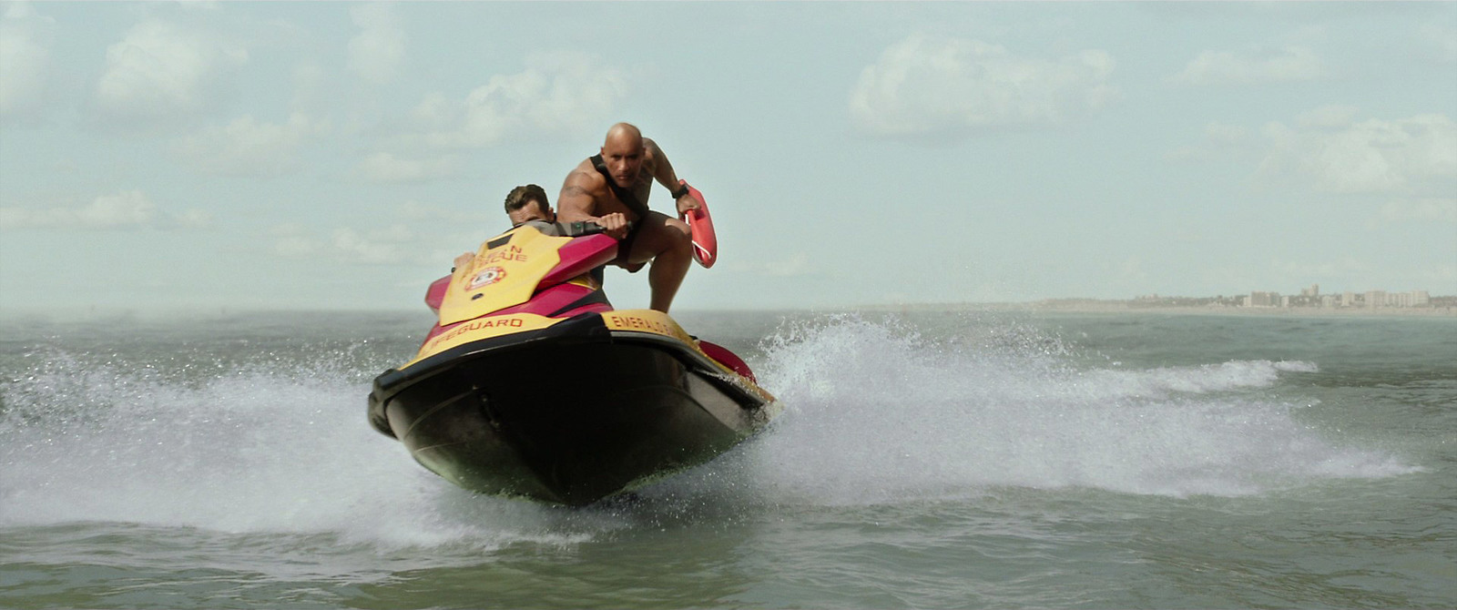 a man riding a jet ski on top of a body of water