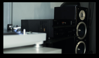 a pair of speakers sitting on top of a table