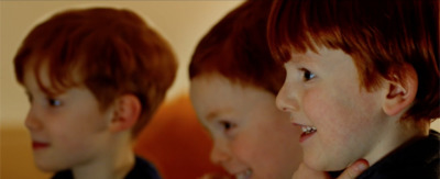 a group of young boys standing next to each other