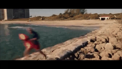 a blurry image of a person running on a beach