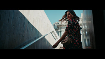 a woman walking down a flight of stairs