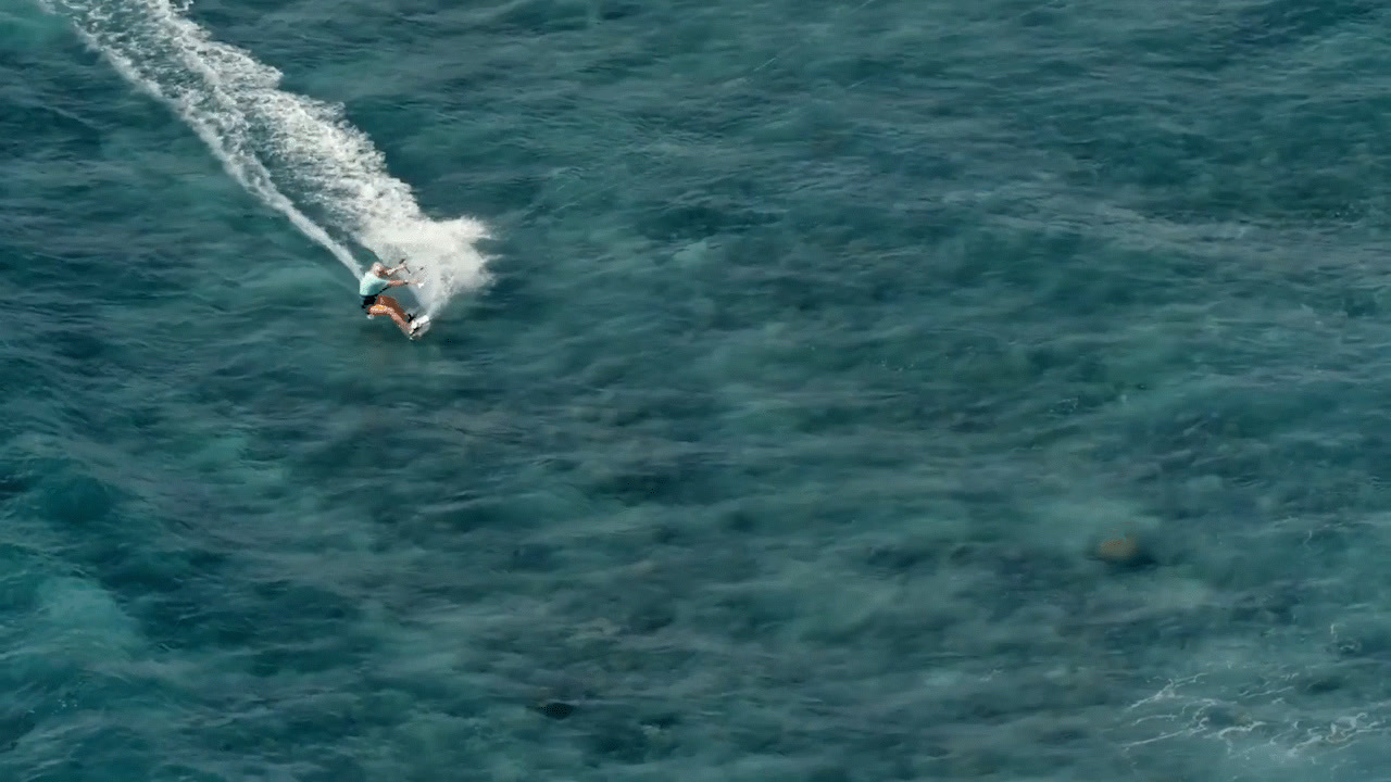 a person riding a surf board on a body of water