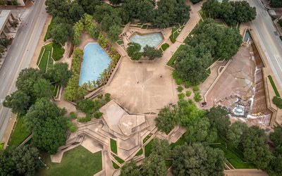 an aerial view of a park with a swimming pool