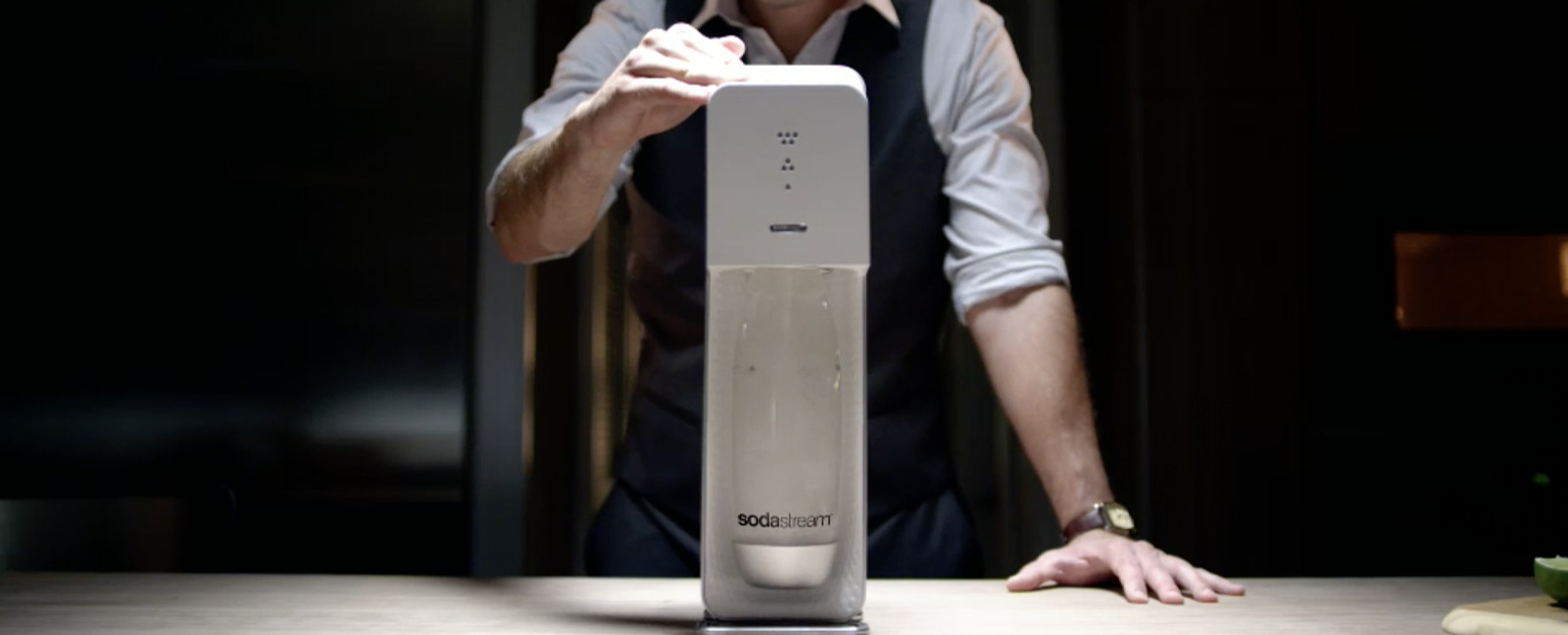 a man standing in front of a water dispenser