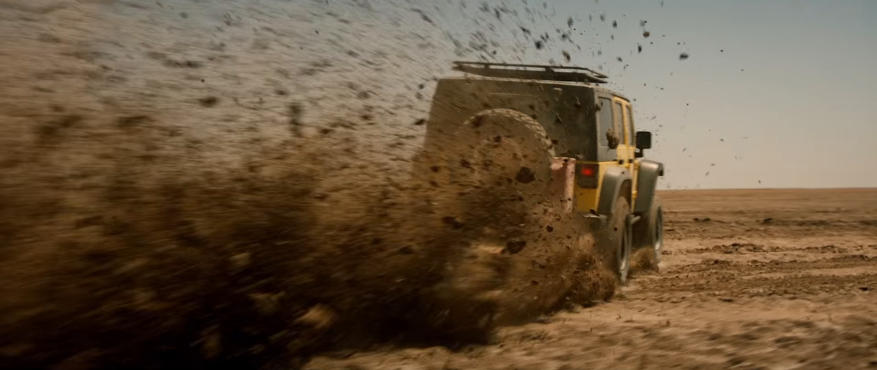 a truck is driving through the mud in the desert