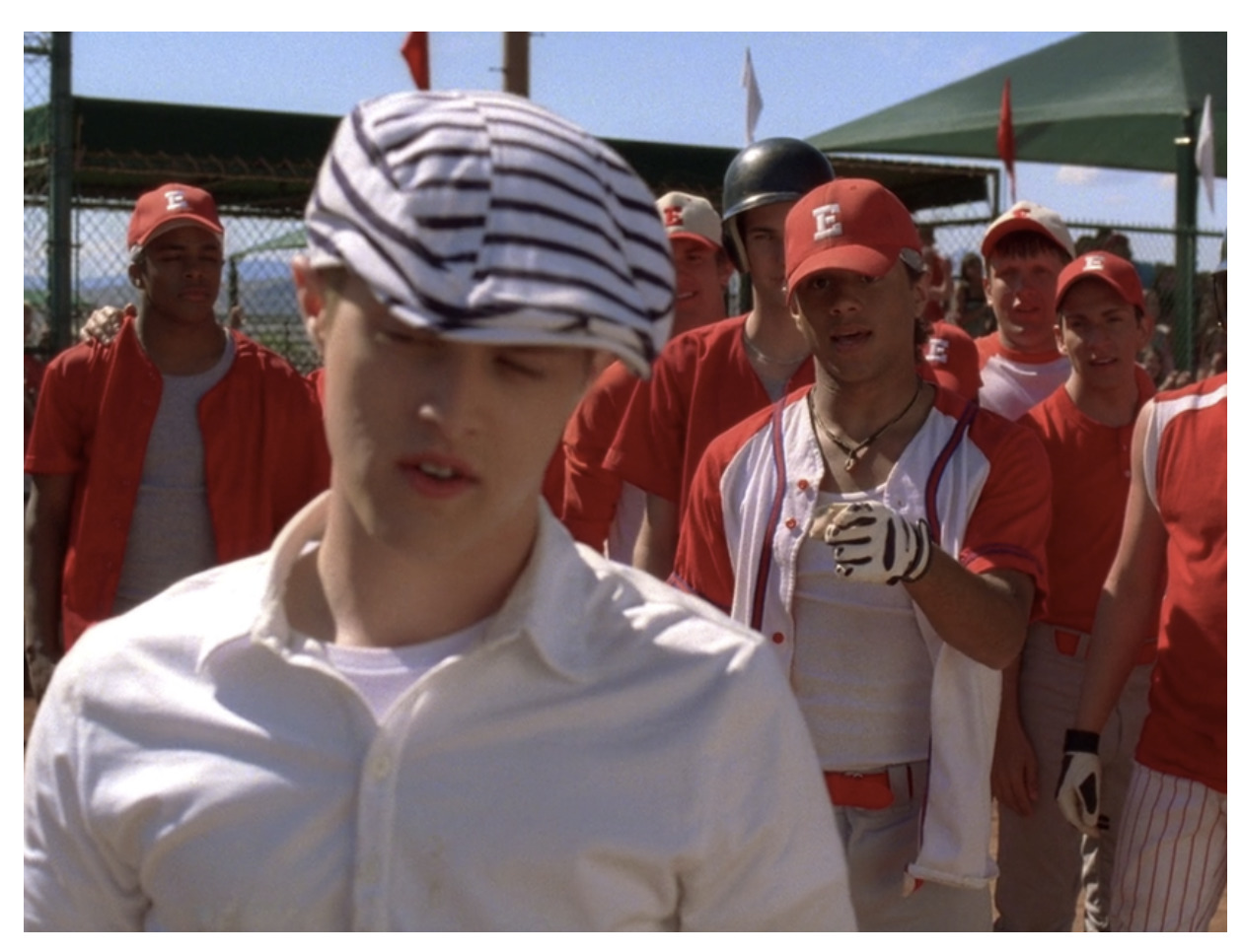 a group of baseball players standing next to each other