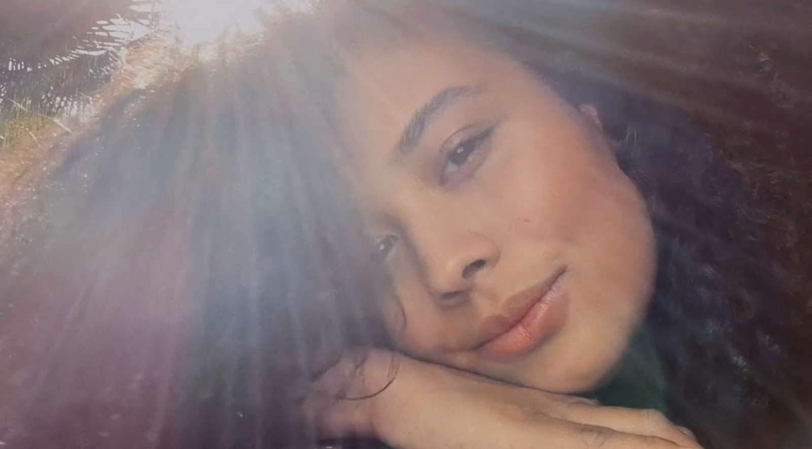 a close up of a person with long hair