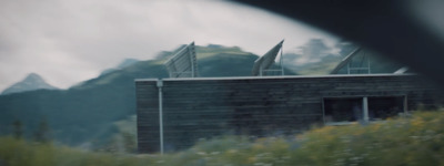 a picture of a house with mountains in the background