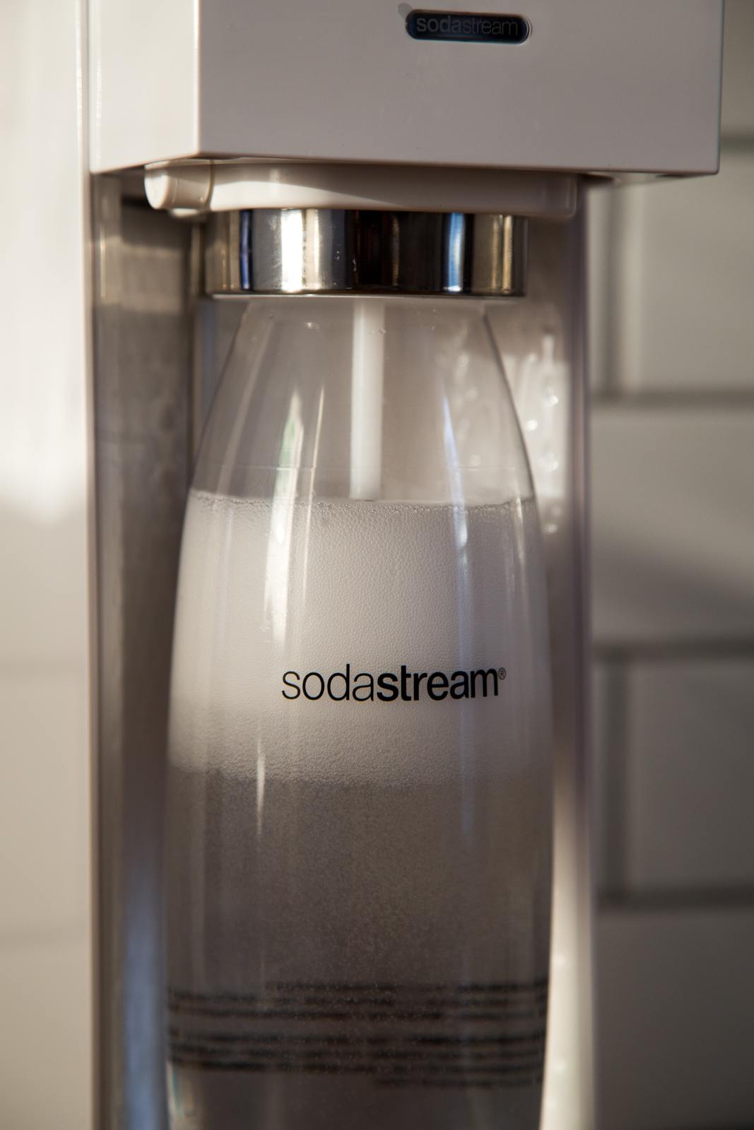 a soda dispenser sitting on top of a counter