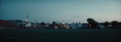 a person standing in a field at night