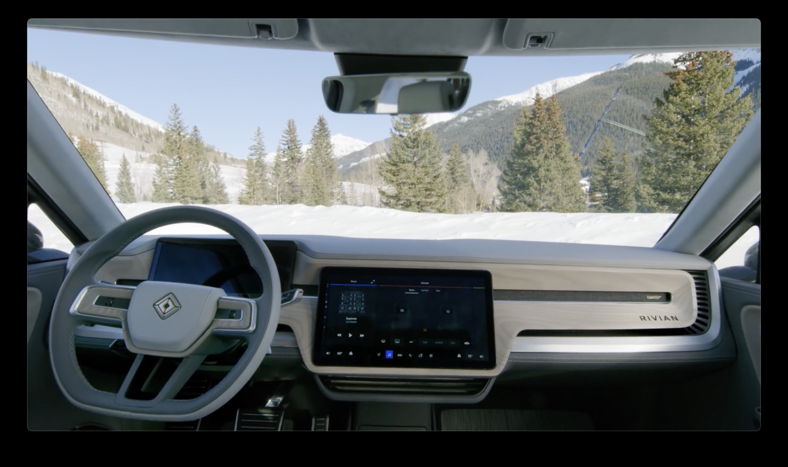 a view of a car dashboard with a mountain in the background