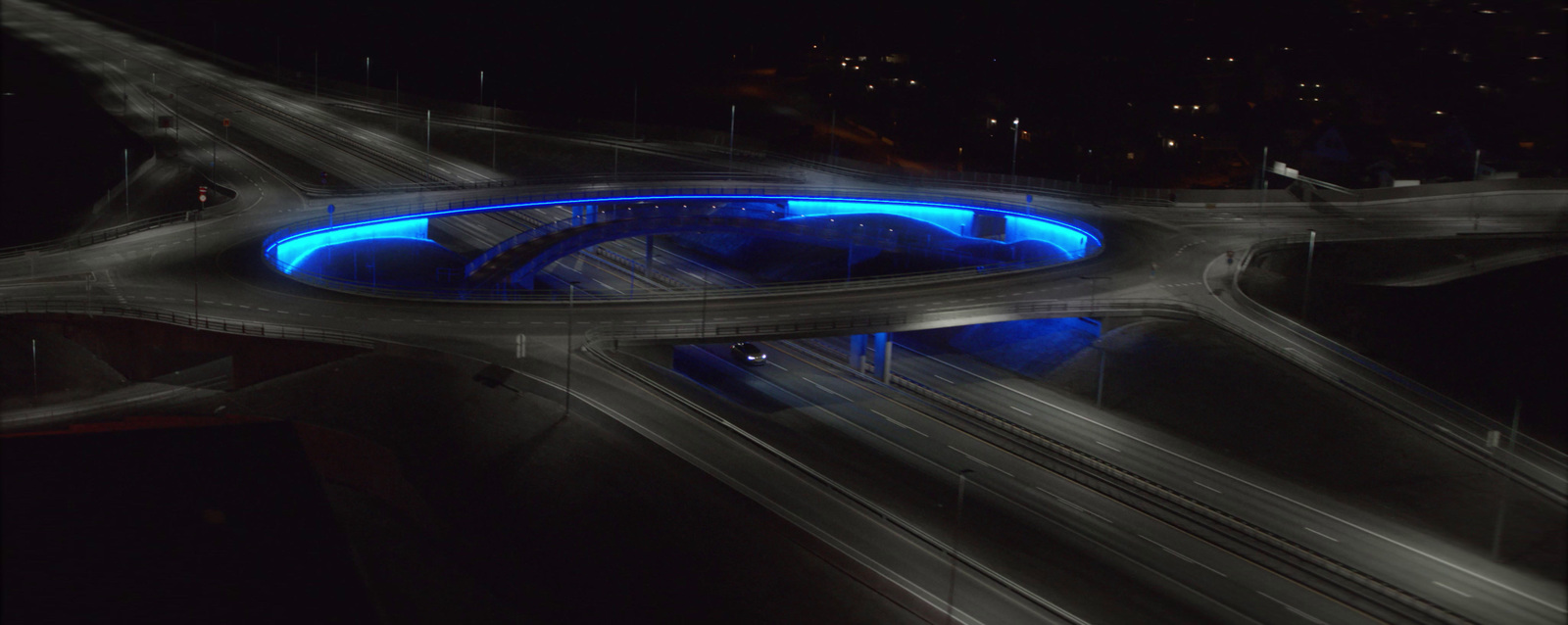 an aerial view of a freeway at night