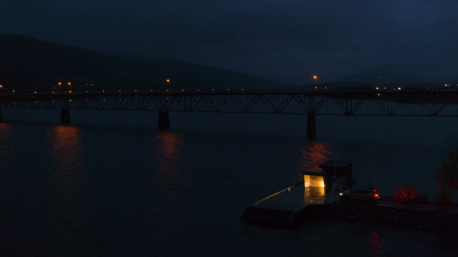 a bridge over a body of water at night