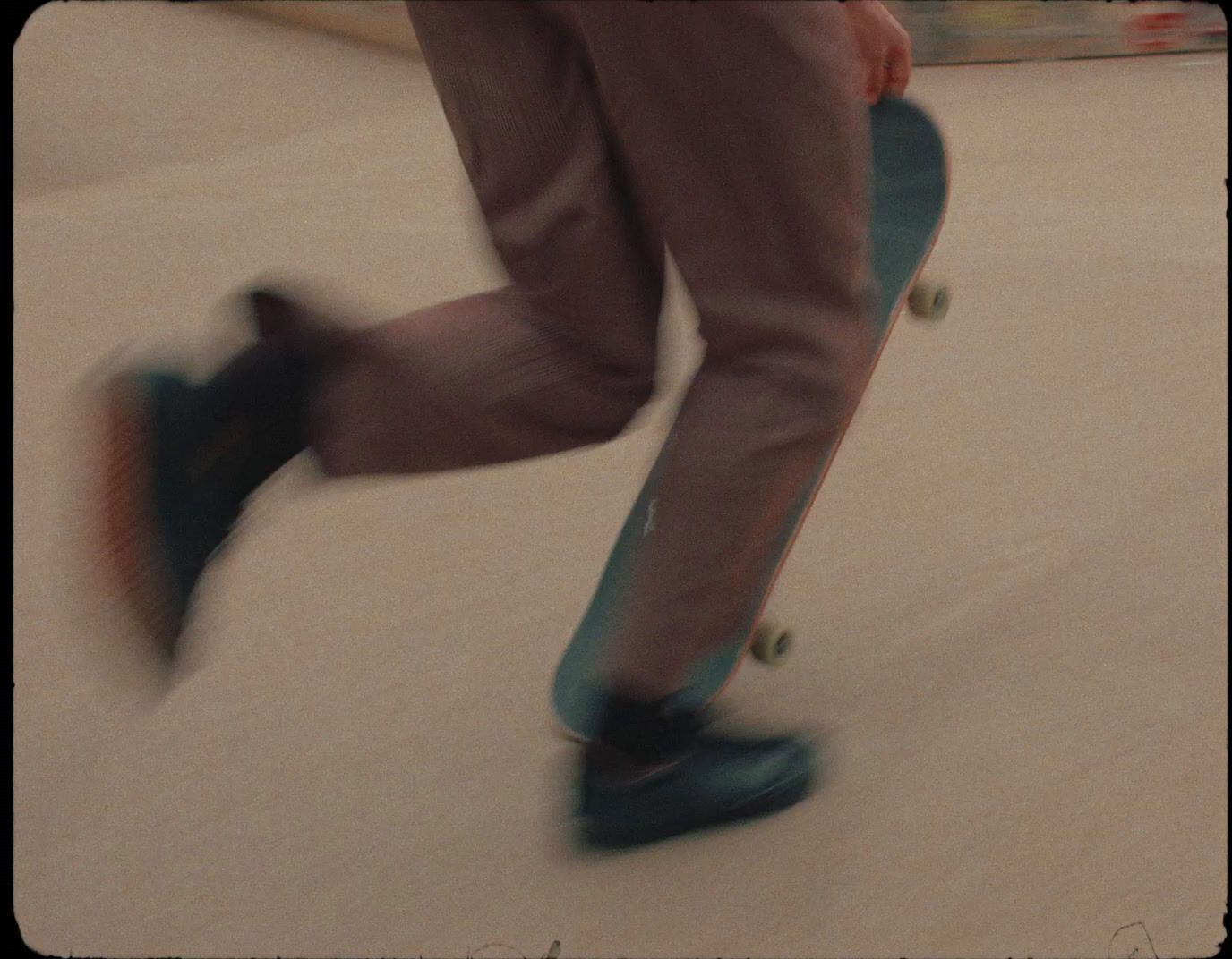 a man riding a skateboard down a street